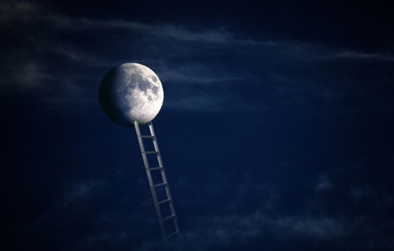 Moon in a dark sky with some clouds and a ladder placed at the edge of the moon